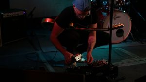 Joey Landreth putting Origin Effects RevivalDRIVE on pedalboard