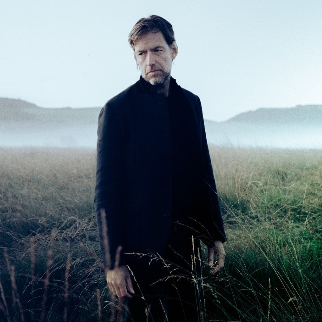 Ed O'Brien standing in a field