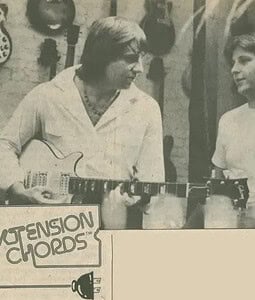Greg Lake holding Dave’s double-cut Les Paul with ‘Strings and Things” owner Chris Lovell. [1973]