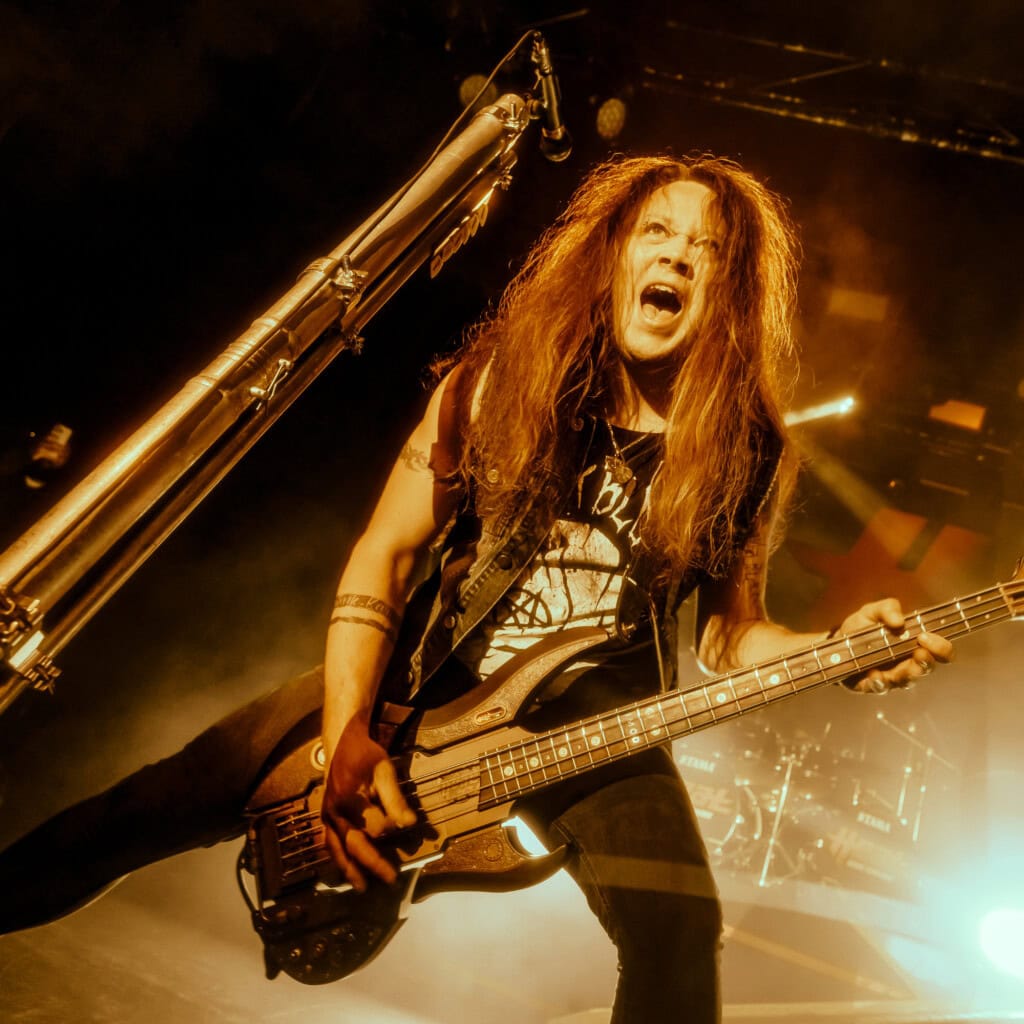 Jimmy Jay playing bass on a large stage