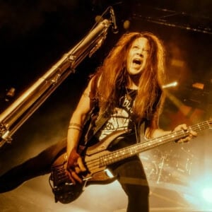 Jimmy Jay playing bass on a large stage