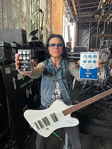 Chuck Garic back stage holding a Cali76 Bass Compressor and a Bassrig Super Vinatage.