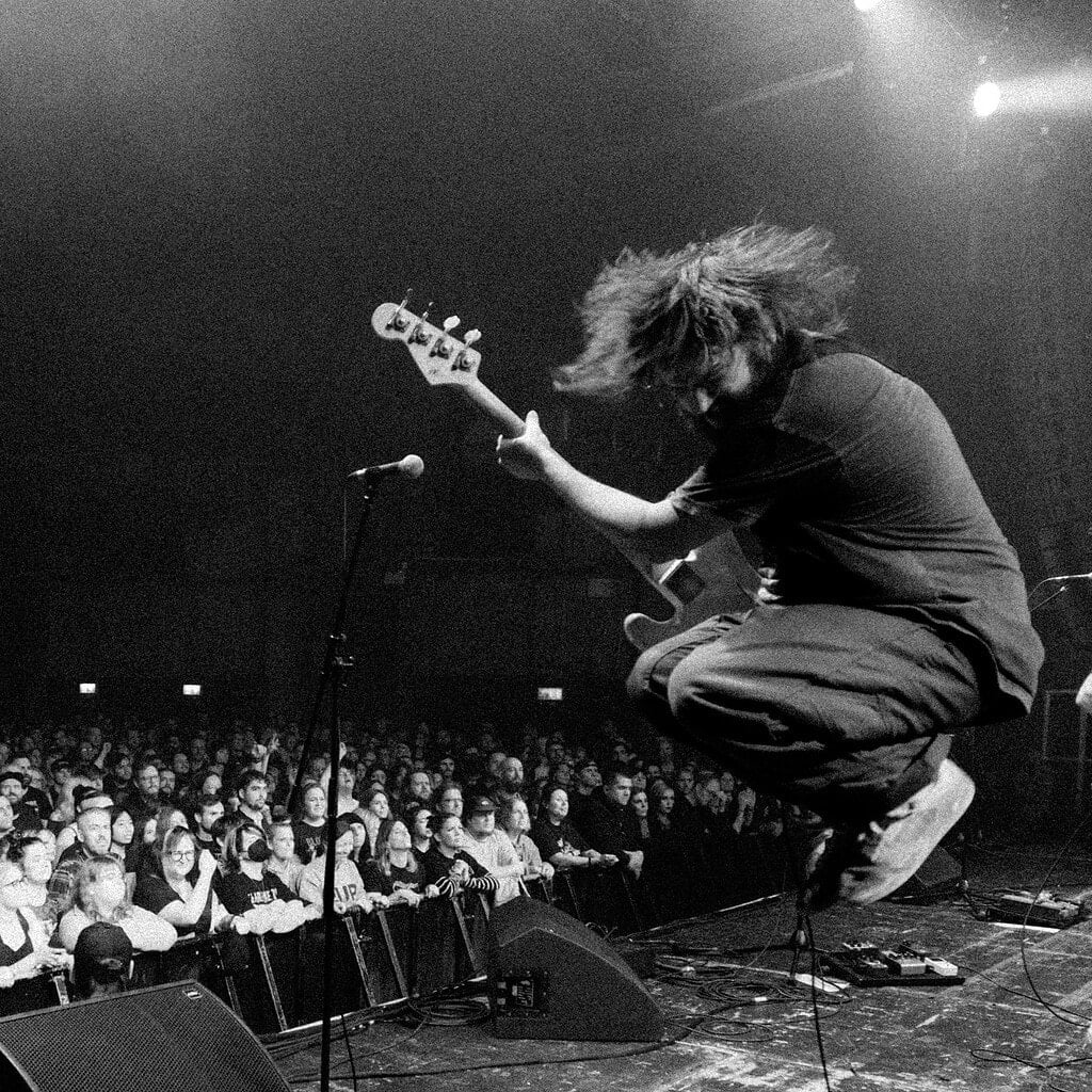Nestor Chumak jumping with a bass