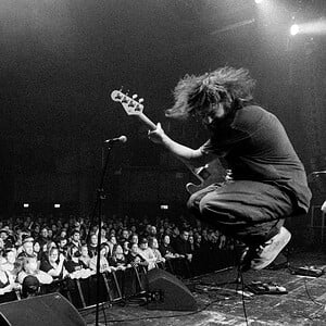 Nestor Chumak jumping with a bass