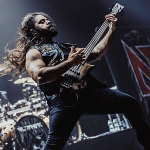 Semir Özerkan playing bass on stage